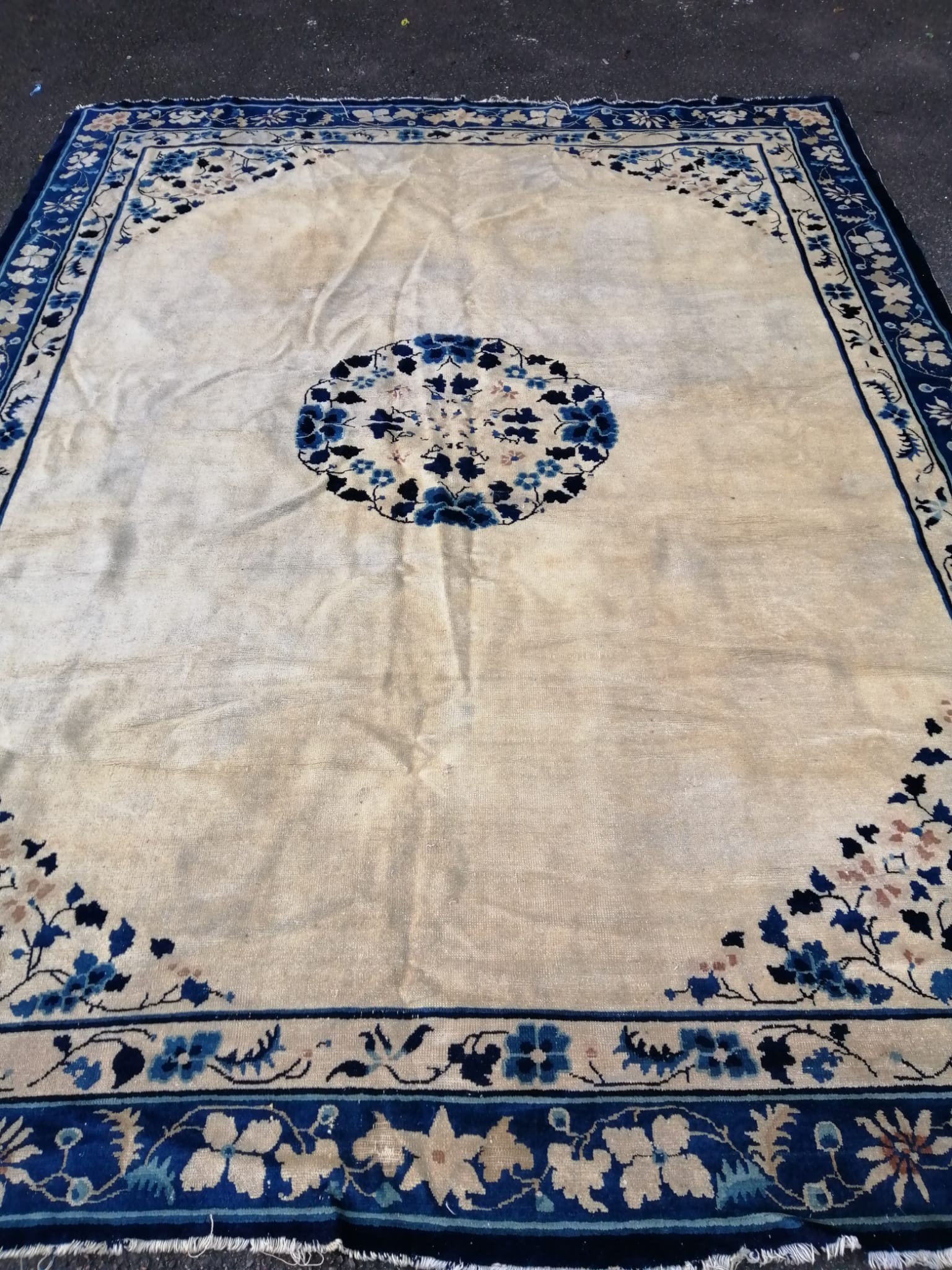 A Chinese ivory ground carpet, 320 x 240cm